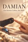 "Damian: Ein kleines Leben, das blieb. Eric B. Jenson." Eine Hand berührt eine schwarze Katzenpfote neben einer blauen Kugel.