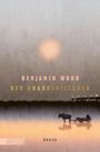 Text: "BENJAMIN WOOD DER KRABBENFISCHER ROMAN DUMONT". Weiche Farben, verschwommene Landschaft mit Sonnenuntergang.