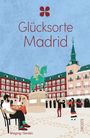 Text: "Glücksorte Madrid", "Wieging / Sardón", "DROSTE". Illustration: Plaza mit Reiterstatue, Personen beim Essen und Tanzen.