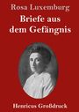 "Rosa Luxemburg, Briefe aus dem Gefängnis, Henricus Großdruck." Ein Porträt einer Frau auf rotem Hintergrund.