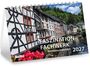 "Faszination Fachwerk Architekturkalender 2027." Fachwerkhäuser an einem Fluss, umgeben von grünen Bäumen und Blumen.