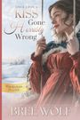 Texte: "Once Upon a Kiss Gone Horribly Wrong", "Whickertons in Love", "USA Today bestselling author Bree Wolf."  
Illustration: Eine Frau in einem roten Kleid, draußen im Schnee.
