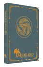 Buch mit blauem Einband, goldene Ecken. Text: "GRUNDREGELWERK", "MIDGARD", "LEGENDEN VON DAMATU". Drache als Emblem.