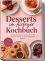 „Desserts im Airfryer Kochbuch“ steht in großen Buchstaben, darunter sind appetitliche Dessertbilder wie Cheesecake und Crème brûlée.