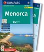 Text: "KOMPASS WANDERFÜHRER Menorca 45 Touren Oliver Lair". Bucht mit sandigem Strand und grün bewachsenen Hügeln.